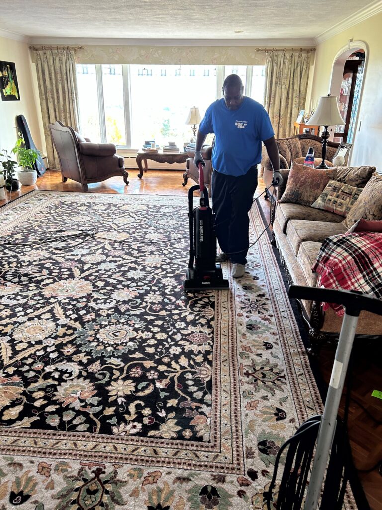 Maurice Johnson, of Connecticut Rug Spa, cleaning a rug.